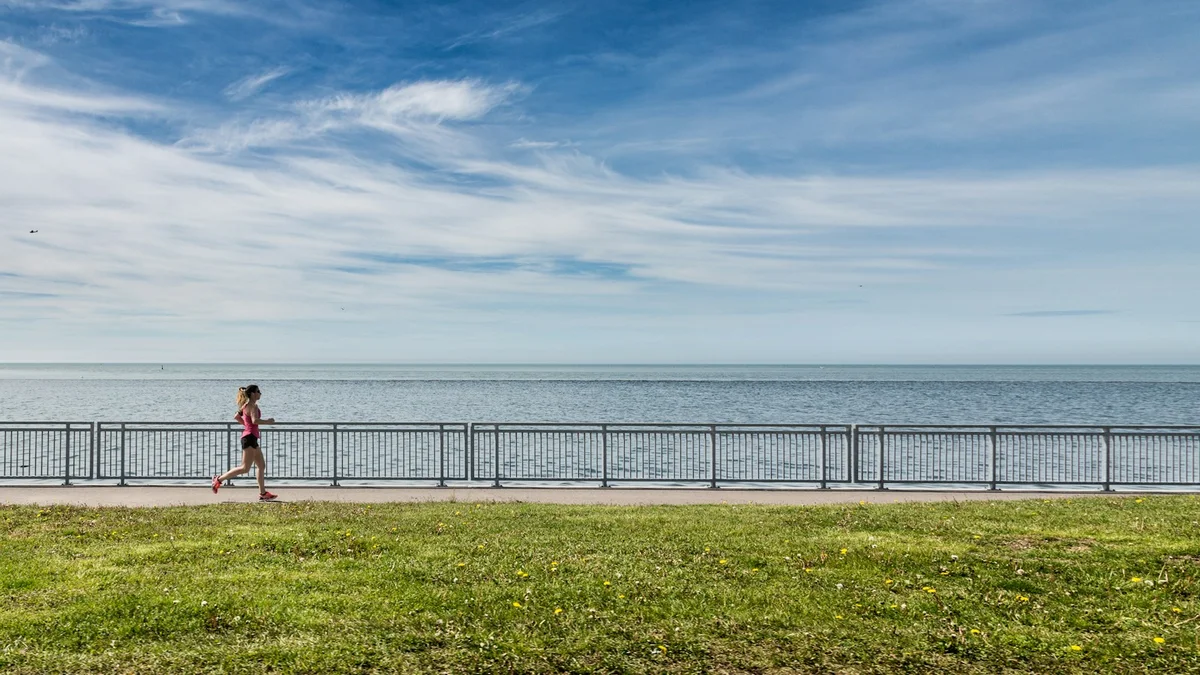 A woman running beside the water