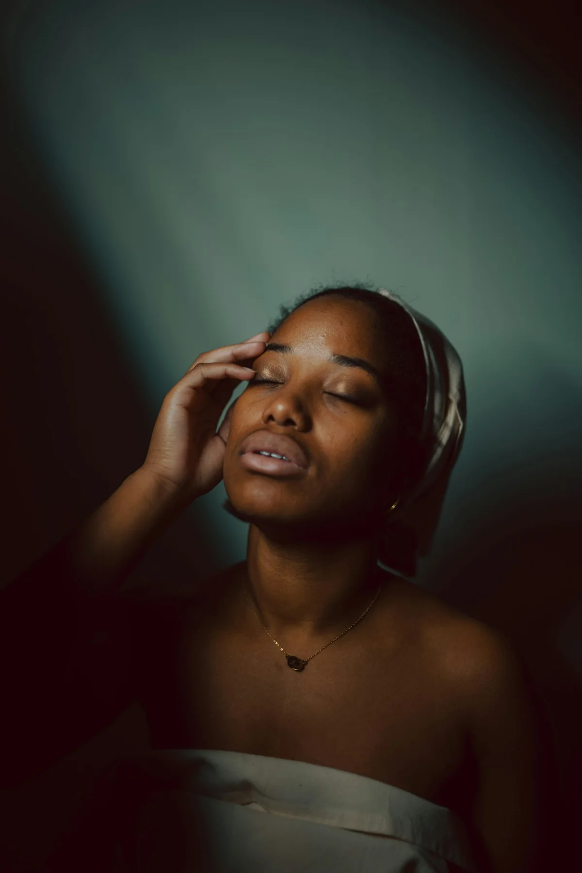 A woman listening with her eyes closed