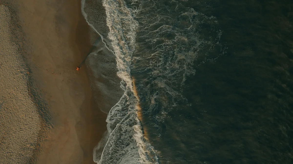 Ocean waves washing over a sandy beach